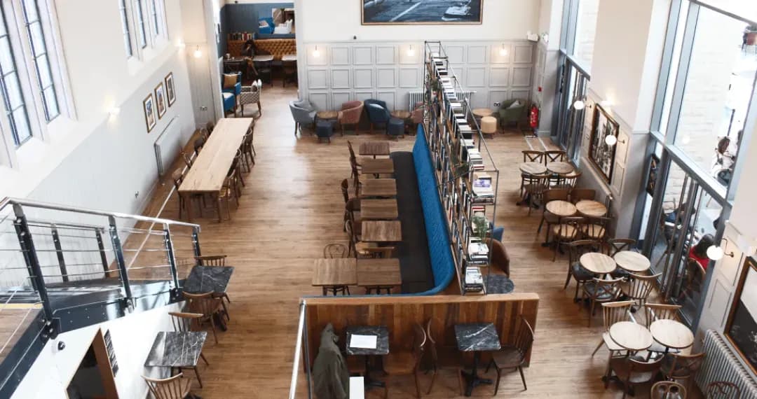 Communal spaces for students to interact, with a café providing a place for casual meetings, socializing, or study breaks