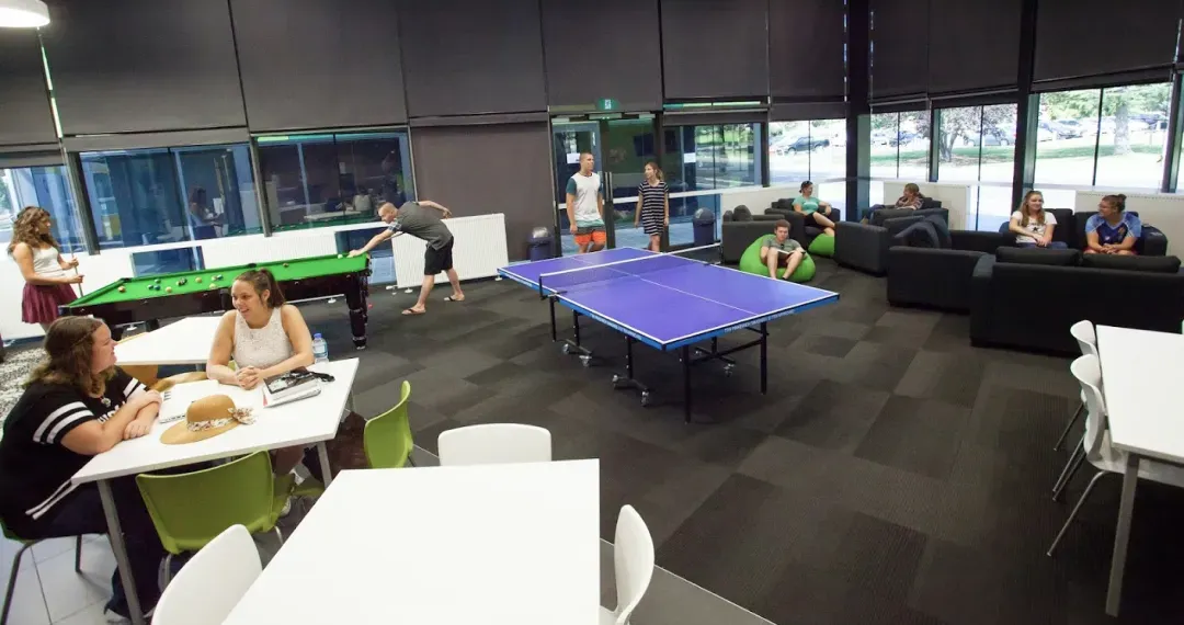 Common Room with pool table tennis, kitchenette and wide screen TV