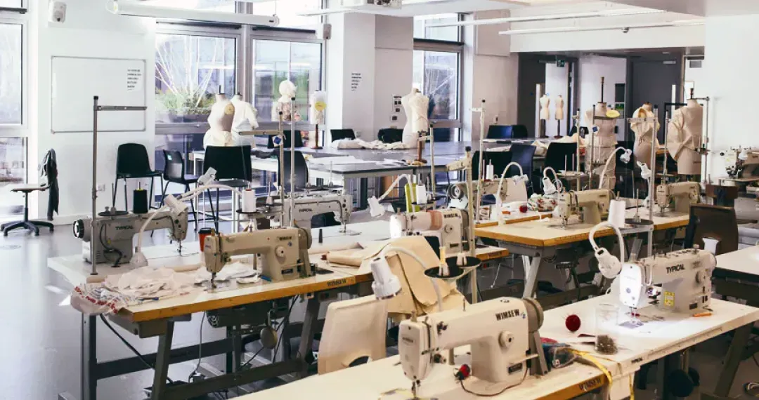 Fashion Studio offers modern sewing machines and large worktables for fashion production