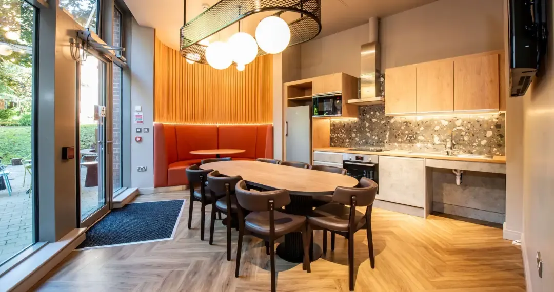 Kitchen Common Space shared kitchen with essential appliances such as stoves, ovens, microwaves, and refrigerators