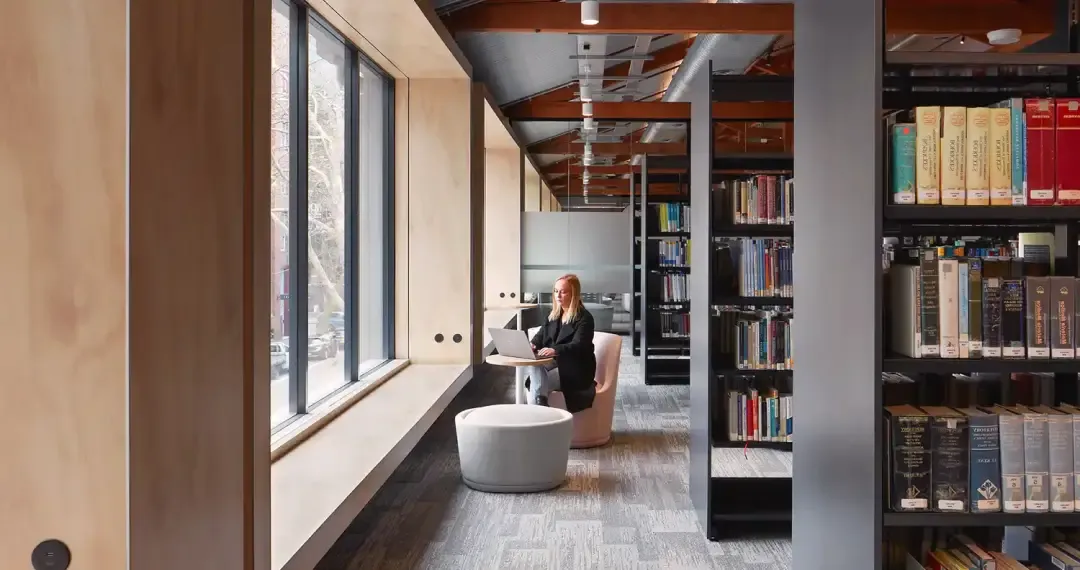 Library Study Space with both individual study areas for quiet work and group study rooms for collaborative projects
