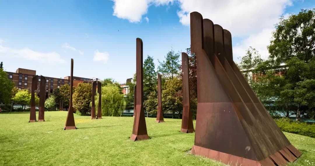 Steel Henge resembling a modern interpretation of ancient stone circles like Stonehenge as public art & gathering space