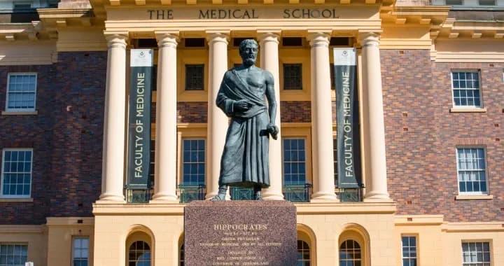 Bronze statue of Hippocrates - the father of medicine in front of the Mayne Medical School Building