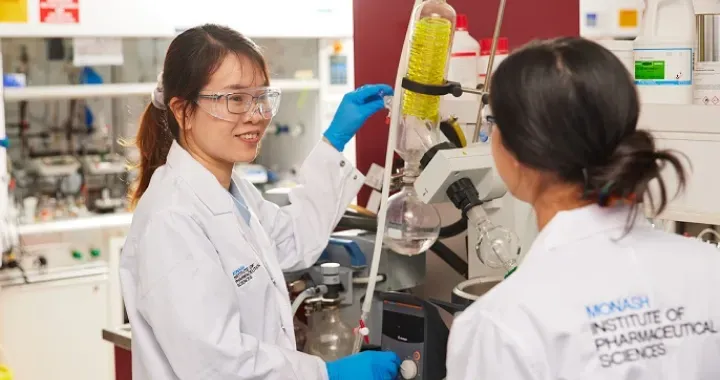 Two researchers working in a medicinal chemistry lab