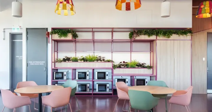 The kitchenette typically includes essential appliances such as microwaves, refrigerators, and sinks